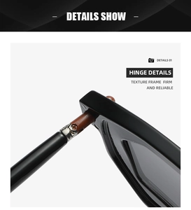 Close-up of the durable metal hinge connecting the black frame and tea-colored temples
