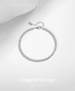 Close-up of s925 sterling silver tennis bracelet with round crystals and lobster clasp