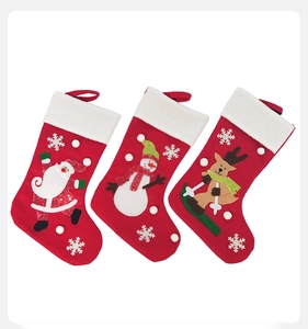 Detail view of felt Christmas stocking set with 3D Santa Snowman and Reindeer embroidery