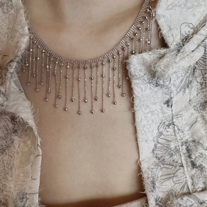 Minimalist silver fringe tassel necklace with multi-layer chains on model neck