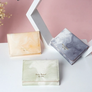 Three minimalist marble-pattern short wallets in orange, blue, and green PU leather