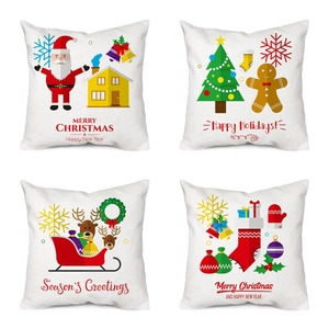 Detailed view of four festive Christmas pillow covers with snowman and holiday prints