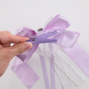 Elegant purple satin and lace bow hair clip with long ribbons and metal duckbill clip