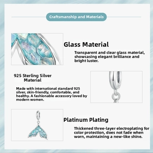 Macro detail of 925 sterling silver fishtail charm with blue scales and engraved S925 mark