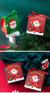 Detail of red and green Christmas gift boxes with ribbons and festive Santa illustrations