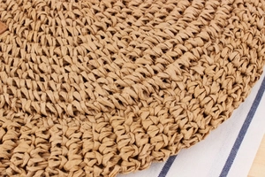 Close-up of tightly woven paper rope material showing natural khaki texture and detail