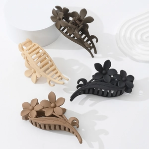 Elegant floral hair claw clips in matte finish colors for messy bun hairstyles