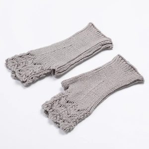 Detailed knit texture of gray fingerless gloves with elegant fish scale hollow pattern