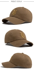 Detail view of brown baseball cap featuring 3D gold gothic letter B embroidery on front