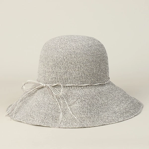 Detailed view of grey hand-woven straw sun hat with fine mesh texture and bow knot