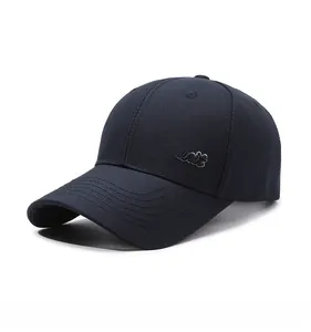 Detail view of navy blue baseball cap featuring white Spirit embroidery on cotton fabric