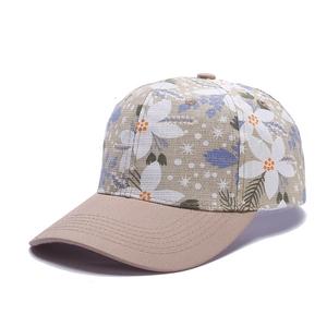 Floral print faux silk baseball cap with khaki brim on white background