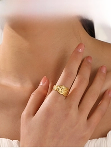 Close-up of 18K gold-plated twisted rope texture ring with embossed vintage line details