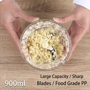 Manual 900ml food chopper with sharp blades for garlic and vegetables on wood background