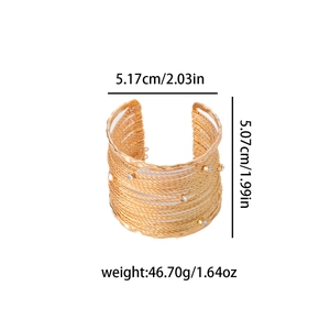 Close-up of golden wide textured bracelet with dimensions 5.17cm and weight 46.70g