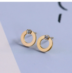 Macro shot of 18K gold plated geometric hoop earrings with sparkling zircon inlay
