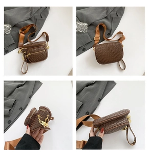 Brown woven texture crossbody fanny pack with multi-zipper pockets and wide strap