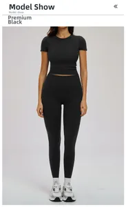 Front view of premium black two-piece yoga set with crop top and high-waisted leggings