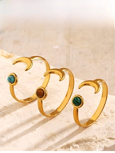 Three gold crescent moon rings with turquoise, tiger eye and malachite stone inlays