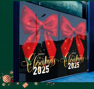 Detail of red velvet bow and Merry Christmas 2025 lettering on glass window sticker