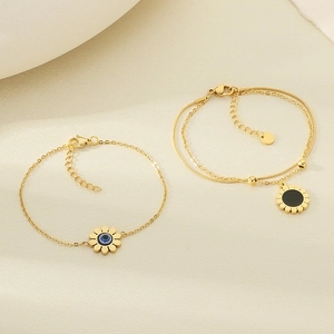 Bracelet tournesol en acier doré avec œil bleu maléfique et design double chaîne élégant
