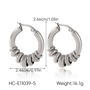 Detail view of silver stainless steel hoop earrings with textured rings and size measurements