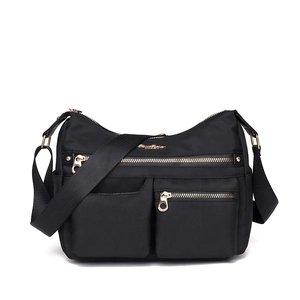 Waterproof black nylon shoulder bag with multi-pockets and gold metal zippers