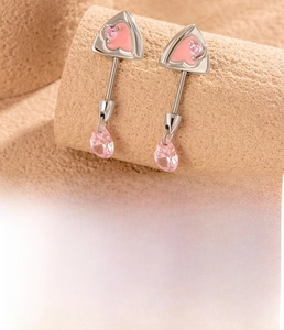 Detail view of 0.8mm titanium steel stud with pink heart zircon and teardrop dangle