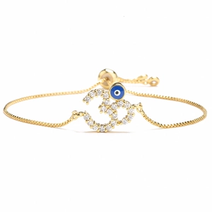 Bracciale regolabile placcato oro 18K con simbolo Om scintillante e ciondolo Evil Eye blu