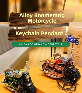 Detailed macro of alloy pull-back motorcycle keychain pendant with speed graphics