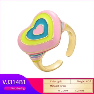 Colorful enamel heart ring in pink and yellow with gold-plated adjustable band