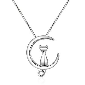 Silver crescent moon and cat pendant necklace with polished finish on a box chain