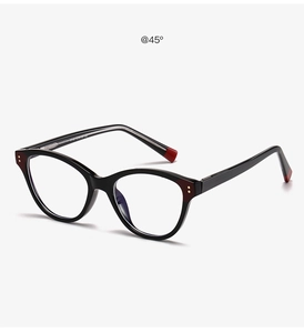 Detail view of round black eyeglass frames with gold rivet accents and size markings
