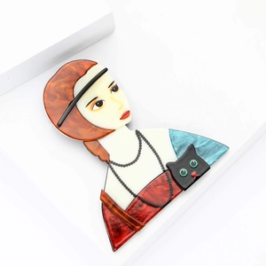 Cartoon acrylic brooch featuring a stylish girl with a black cat on white surface