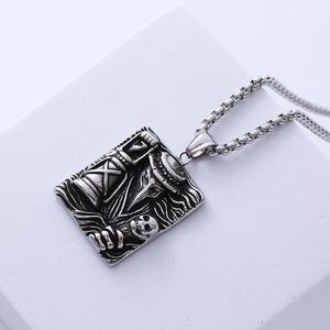 Macro detail of gothic plague doctor relief on silver steel rectangular pendant