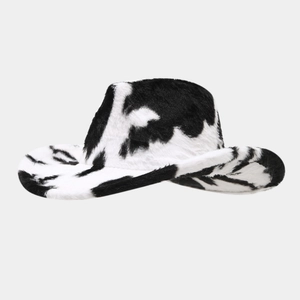 Detailed view of the soft cow print faux fur texture on a classic western cowboy hat