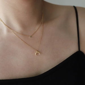 Double-layered gold titanium steel necklace featuring a green gem and crescent moon pendant