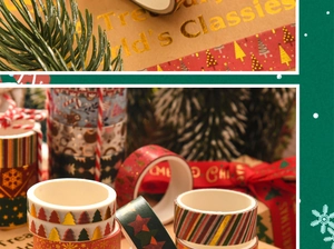 Detailed view of Christmas washi tape with gold foil snowflakes and trees on gift wrap