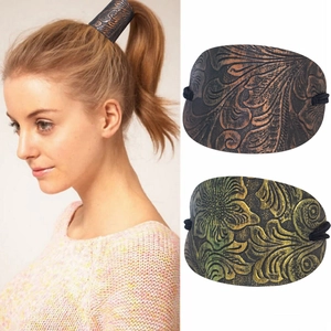 Vintage leather ponytail holder with embossed floral pattern and elastic band for women