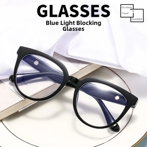 Detail of stylish oversized black frame glasses with blue light blocking lenses on a tray
