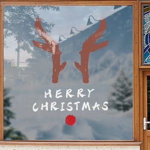 Christmas reindeer antler window stickers with Merry Christmas text on glass storefront