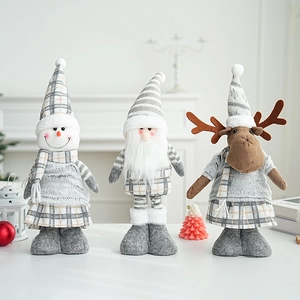 Three plush Christmas figurines featuring Santa, Snowman, and Reindeer in grey tones