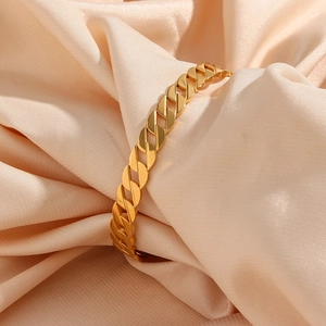 Detail of 18K gold-plated double-layer bracelet with sparkling zircon on satin background