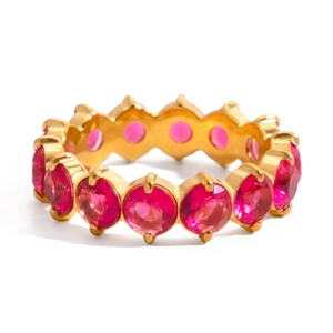 Detailed view of eternity ring with pink round-cut zircons on wavy golden band