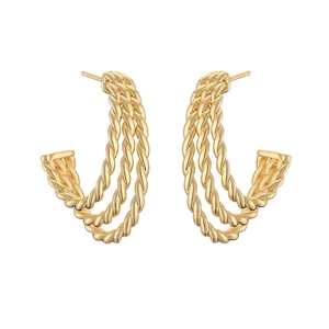Detail of 18K gold plated C-shaped earrings with a triple twisted rope design
