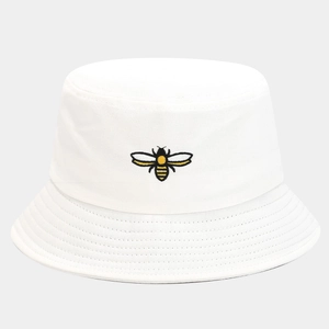 Detailed close-up of high-quality bee embroidery on a white cotton canvas bucket hat