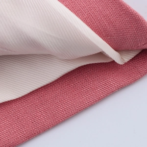 Detailed macro view of pink tweed fabric texture and smooth white twill lining fabric