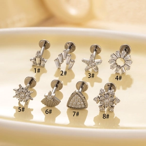 Titanium flat back studs featuring various zircon snowflake and star shapes in silver finish