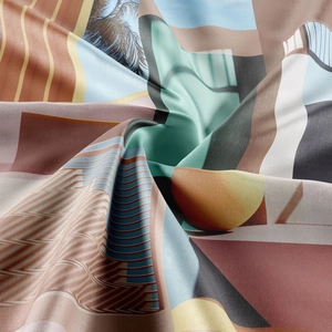 Macro view of silky bohemian tapestry fabric showing abstract tropical palm patterns