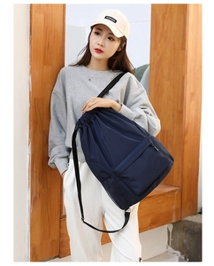 Casual nylon drawstring backpack for women and men, lightweight gym sports bag with zipper pocket.